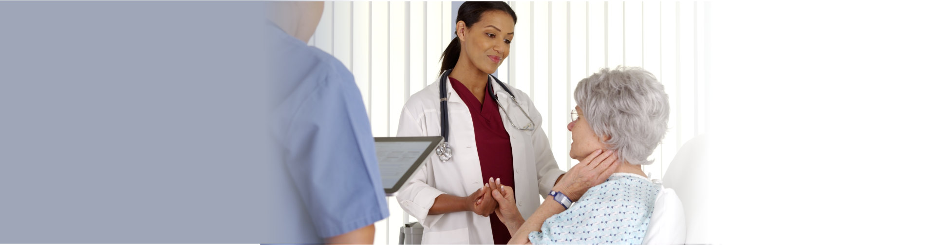 doctor and nurse talking to patient